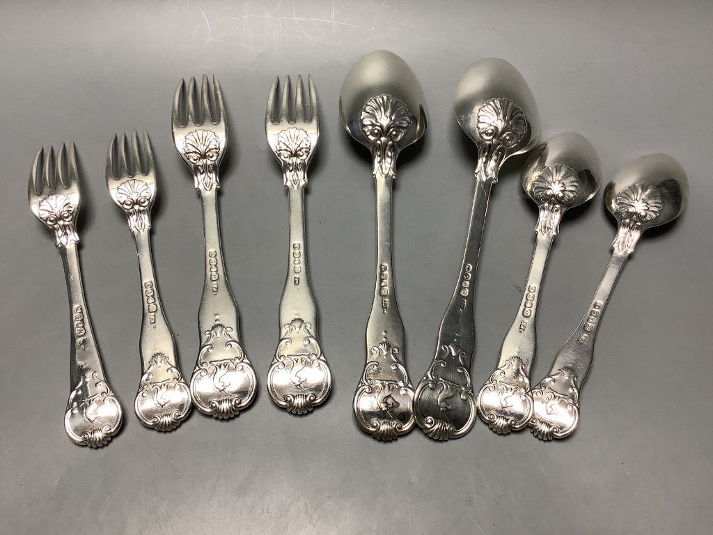 Seven items of George IV silver shell pattern flatware, William M. Traies, London, 1829, one other similar dessert fork and three silver handled knives, weighable silver 19.5 oz.